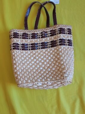 Handmade corn dusk handbag a woven natural body with dark brown accent weaving